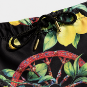 Men's Sicilian-print swim trunks - wheel and lemons